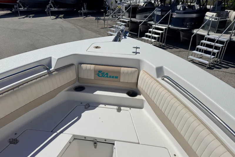 Slide: The Image of 2015 Sea Chaser 22 HFC boat interior with cushioned seating and storage compartments. - 15