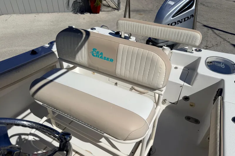 Slide: The Image of 2015 Sea Chaser 22 HFC boat interior with seating and Honda engine. - 18