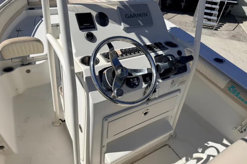 Slide: The Image of 2015 Sea Chaser 22 HFC boat console with Garmin navigation system and steering wheel. - 20