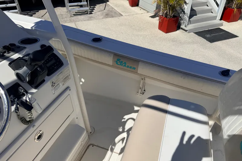 Slide: The Image of 2015 Sea Chaser 22 HFC boat interior with steering console and seating. - 21