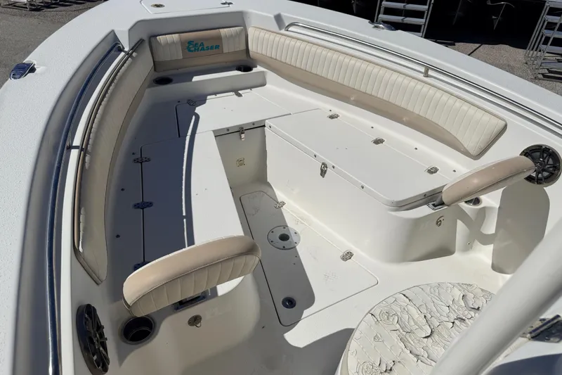 Slide: The Image of 2015 Sea Chaser 22 HFC boat interior with seating and storage compartments. - 22