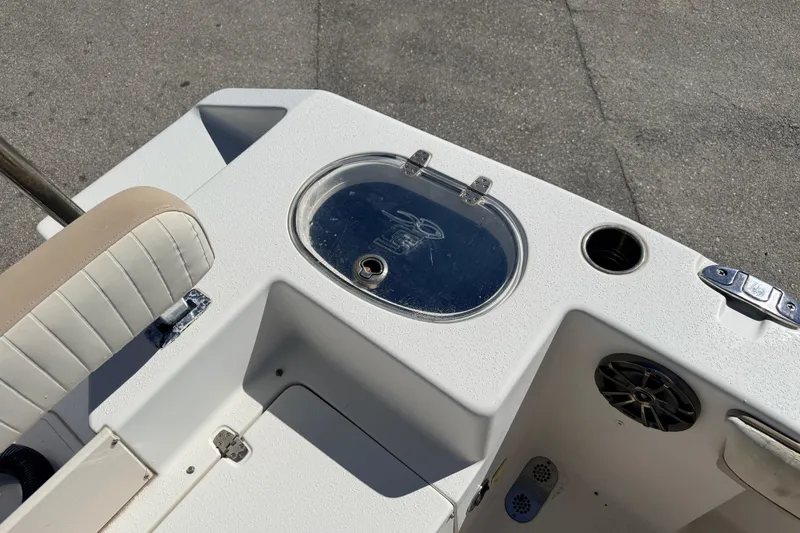 Slide: The Image of 2015 Sea Chaser 22 HFC boat interior with seating, storage, and speaker. - 26