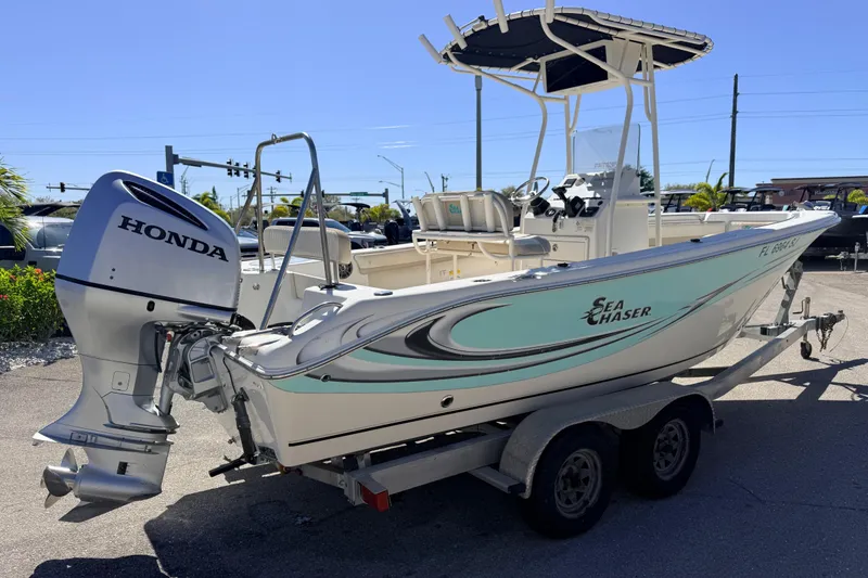 Slide: The Image of 2015 Sea Chaser 22 HFC boat with Honda outboard motor on trailer. - 7