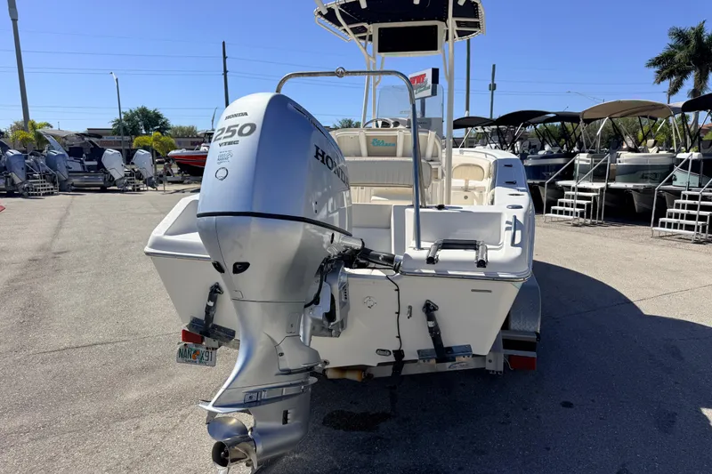 Slide: The Image of 2015 Sea Chaser 22 HFC boat with Honda 250 VTEC engine, parked outdoors. - 9
