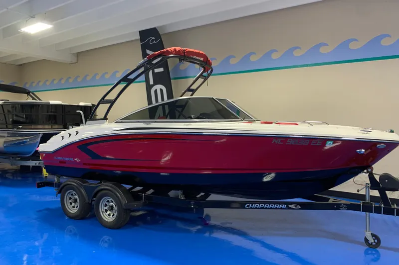Slide: The Image of 2017 Chaparral 21 H2O Sport boat on trailer in showroom. - 1