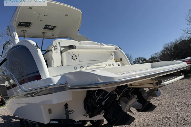 Slide: The Image of 2018 Formula 34 Performance Cruiser boat, rear view, showcasing sleek design and powerful engines. - 10