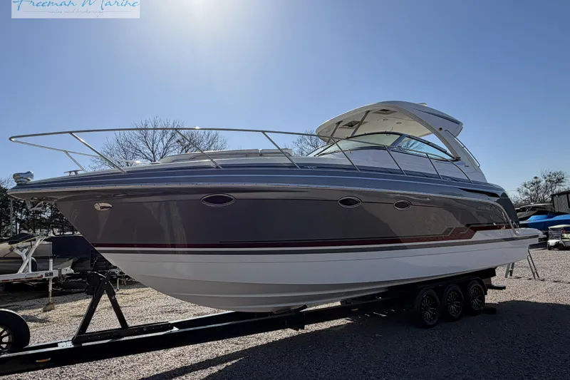 Slide: The Image of 2018 Formula 34 Performance Cruiser on trailer, sleek design, parked outdoors. - 12