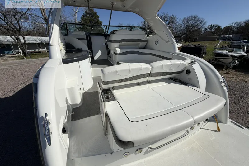 Slide: The Image of 2018 Formula 34 Performance Cruiser with spacious seating and sleek design in outdoor setting. - 13