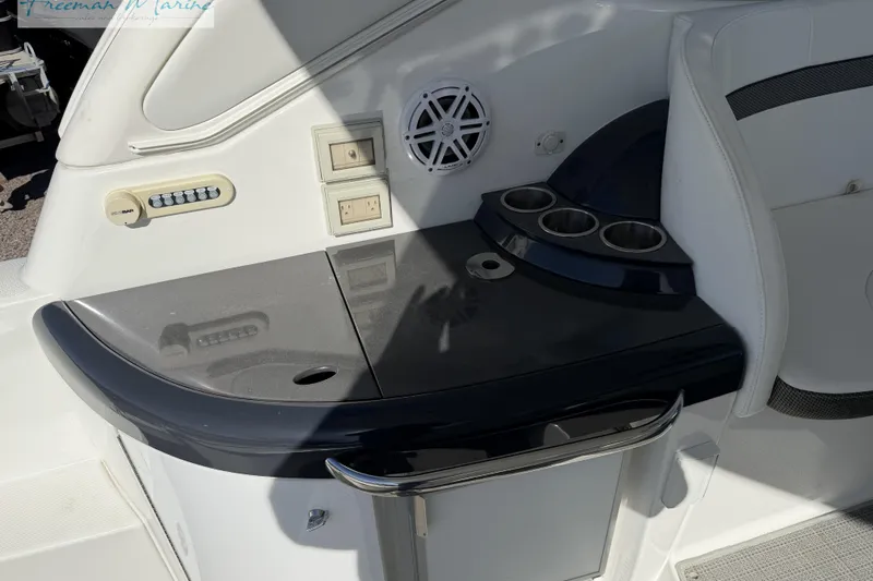 Slide: The Image of 2018 Formula 34 Performance Cruiser interior with control panel and cup holders. - 18