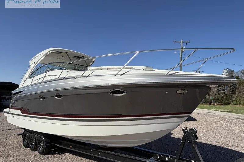 Slide: The Image of 2018 Formula 34 Performance Cruiser on trailer, sleek design under clear blue sky. - 2