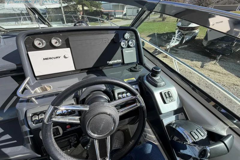 Slide: The Image of 2018 Formula 34 Performance Cruiser cockpit with steering wheel and control panel. - 22