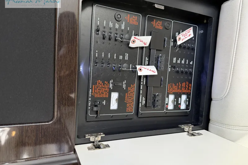 Slide: The Image of Electrical panel of a 2018 Formula 34 Performance Cruiser boat, featuring labeled switches and controls. - 32