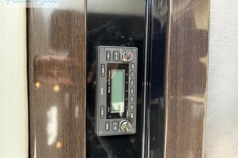 Slide: The Image of Control panel on 2018 Formula 34 Performance Cruiser with wood finish. - 33