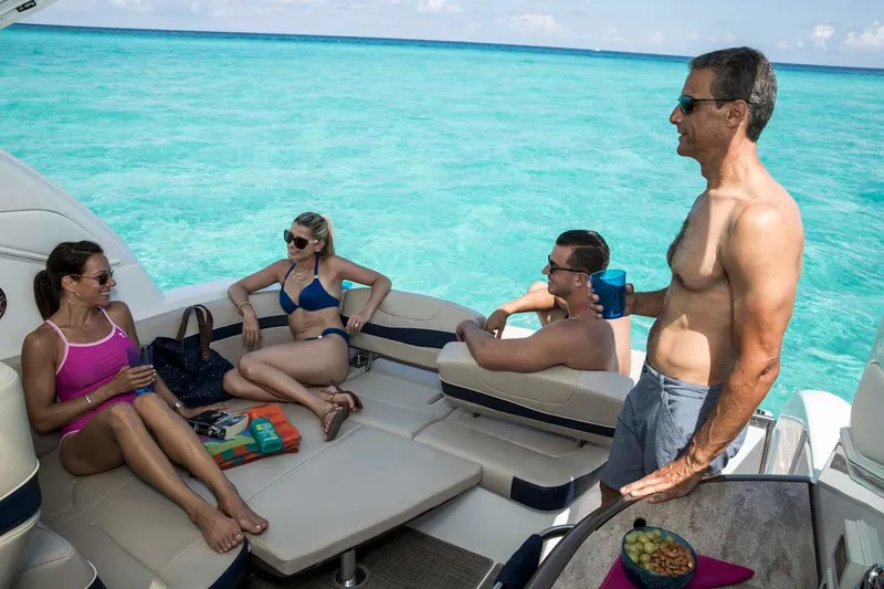 Slide: The Image of Manufacturer Provided Image: People relaxing on a 2018 Formula 34 Cruiser yacht in clear blue waters. - 36