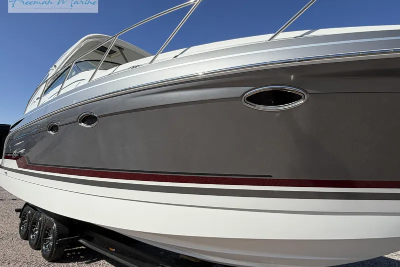 Slide: The Image of 2018 Formula 34 Performance Cruiser boat on trailer, side view under clear sky. - 4