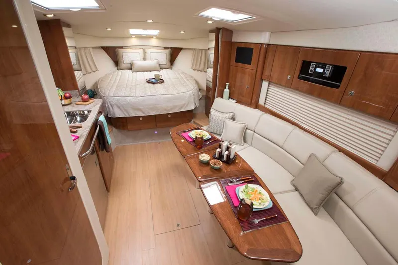 Slide: The Image of Manufacturer Provided Image: Luxurious interior of a 2018 Formula 34 Cruiser yacht with a cozy bed and dining area. - 40