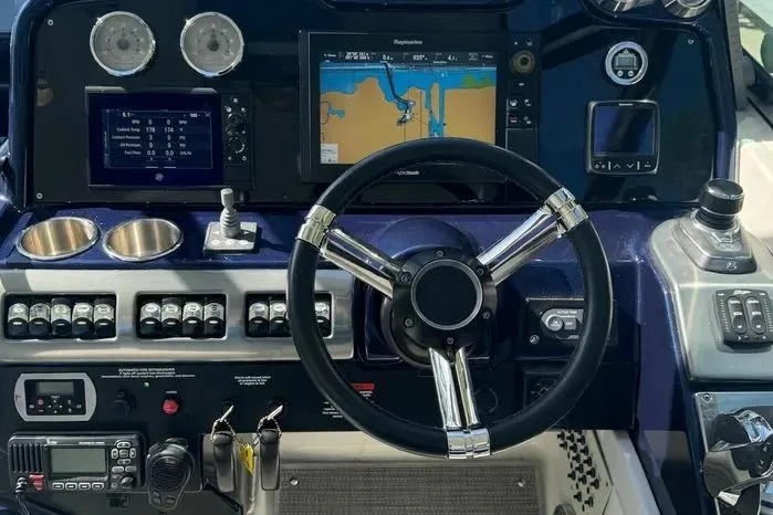 Slide: The Image of Dashboard of a 2017 Formula 400 Super Sport boat with navigation controls. - 13