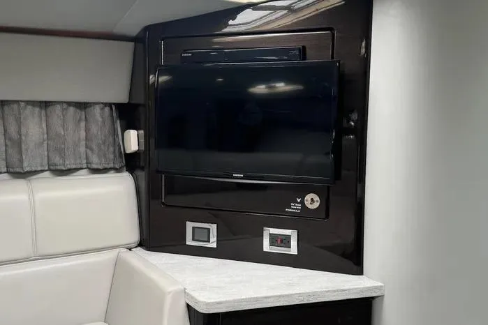 Slide: The Image of Interior of 2017 Formula 400 Super Sport yacht with mounted TV and modern seating. - 15