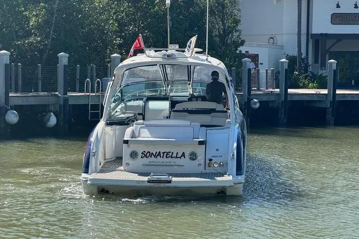 Slide: The Image of 2017 Formula 400 Super Sport boat named Sonatella docked in a marina. - 9