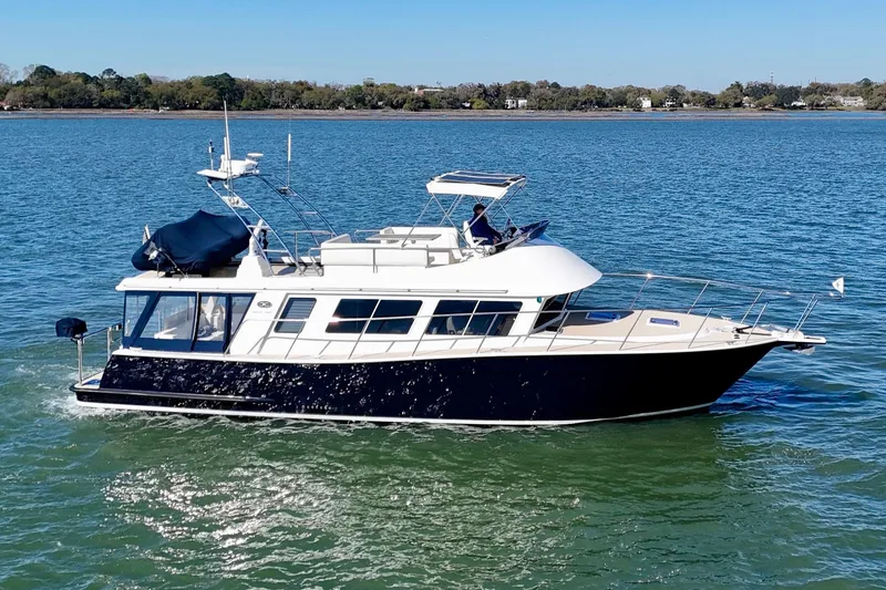 The Image of 2015 Coastal Craft 45 yacht cruising on calm waters under clear skies. - 0