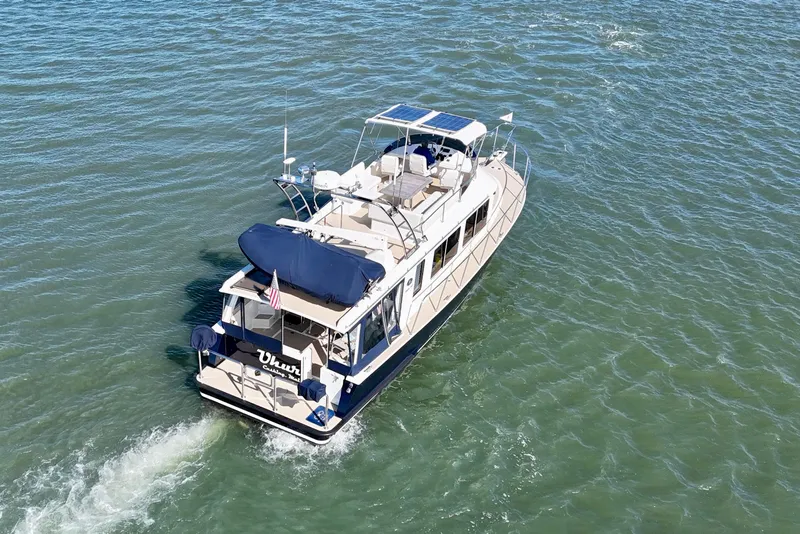 Slide: The Image of 2015 Coastal Craft 45 yacht cruising on open water. - 8