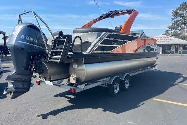 Slide: The Image of 2024 Bennington 23 RXFBA pontoon boat on trailer with Yamaha outboard motor. - 2