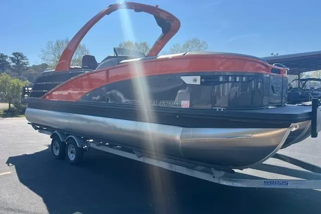 Slide: The Image of 2024 Bennington 23 RXFBA pontoon boat on trailer, featuring sleek design and vibrant colors. - 4