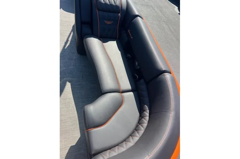 Slide: The Image of Luxurious seating on 2024 Bennington 23 RXFBA boat with sleek design and orange accents. - 8
