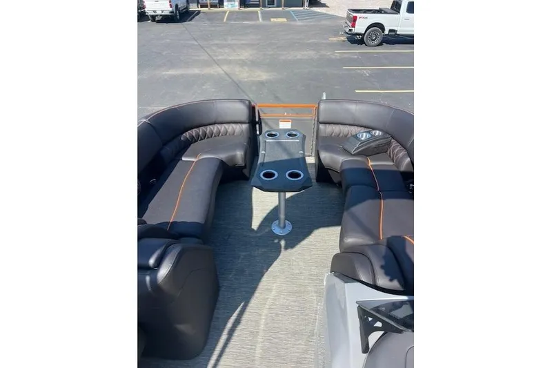 Slide: The Image of 2024 Bennington 23 RXFBA boat interior with luxurious seating and cup holders. - 9