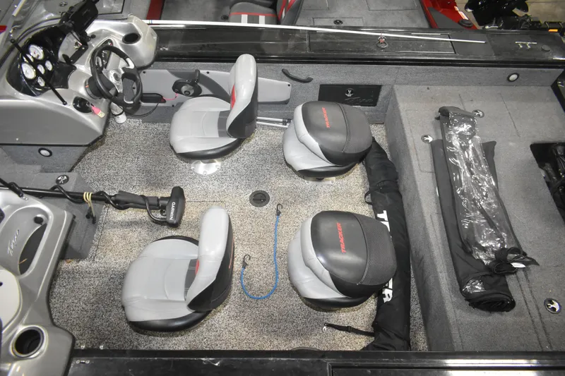 Slide: The Image of 2015 Tracker Targa 18 WT boat interior with seating and fishing gear. - 10