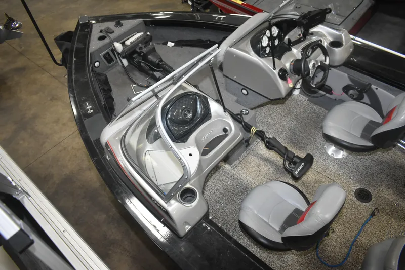 Slide: The Image of 2015 Tracker Targa 18 WT boat interior with steering console and seating. - 11
