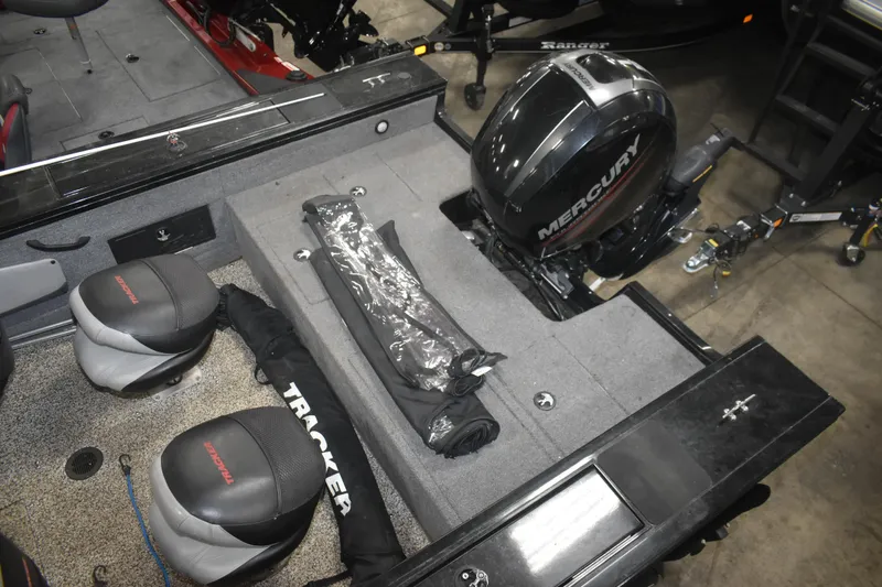 Slide: The Image of 2015 Tracker Targa 18 WT boat interior with Mercury engine and seating. - 12