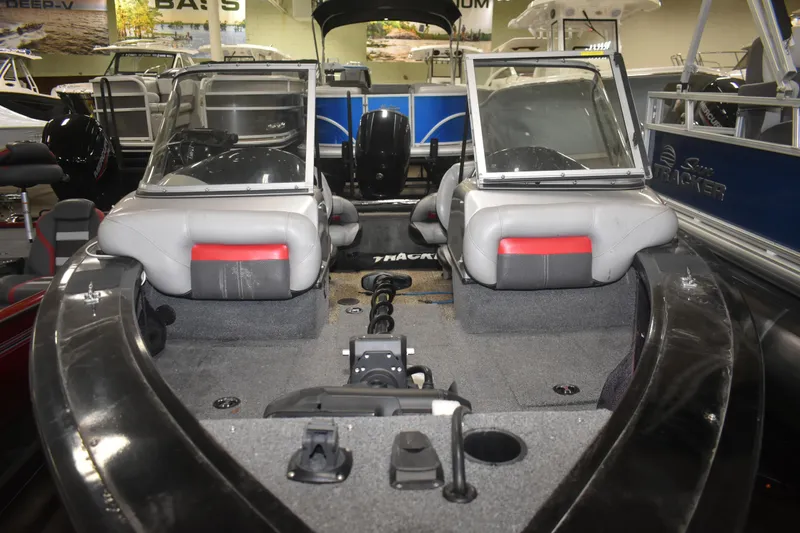 Slide: The Image of 2015 Tracker Targa 18 WT boat interior with seating and dashboard view. - 7