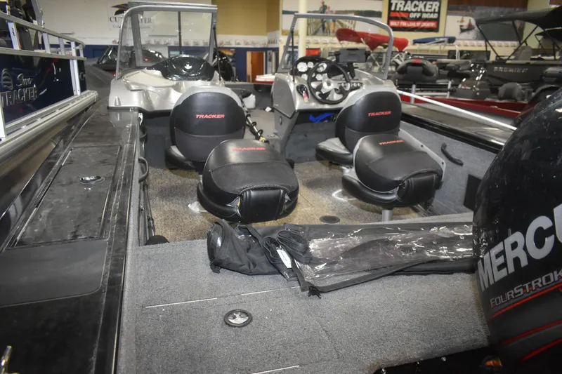 Slide: The Image of 2015 Tracker Targa 18 WT boat interior with seating and Mercury engine. - 9