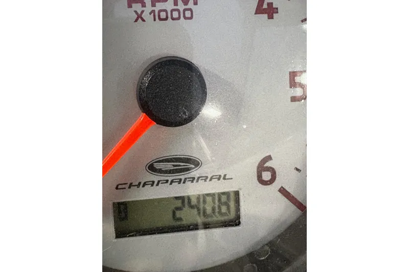 Slide: The Image of Close-up of a Chaparral 216 SSi 2011 tachometer displaying 241 hours. - 11