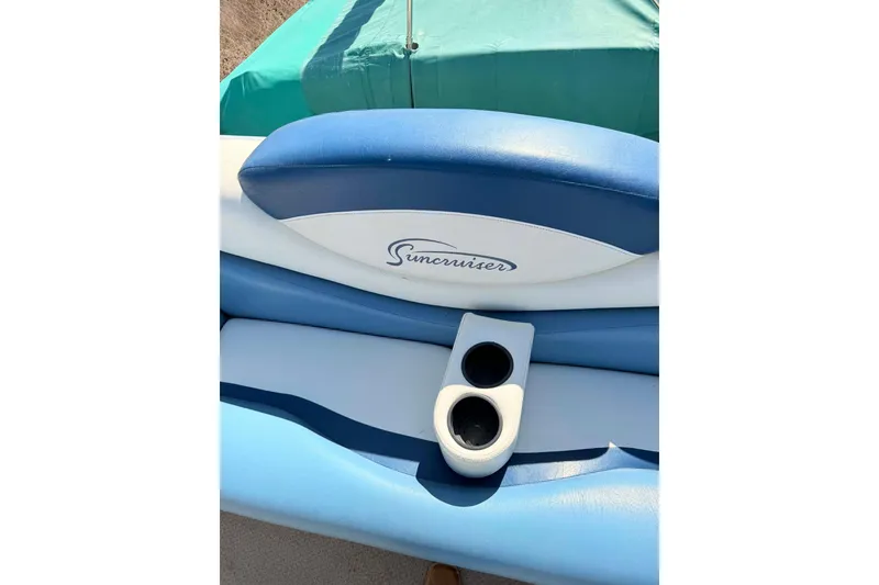 Slide: The Image of Blue and white seating with cup holders on a 2004 Lowe Jamaica 250 boat. - 10