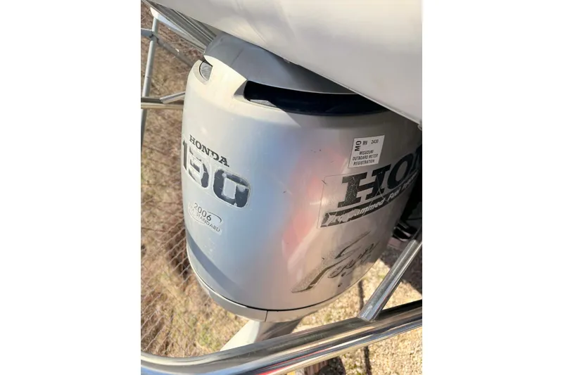 Slide: The Image of Honda 150 outboard motor on a 2004 Lowe Jamaica 250 boat. - 9