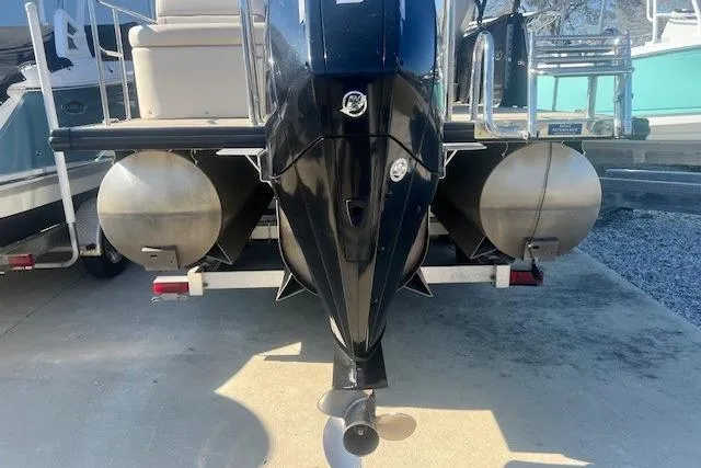 Slide: The Image of 2019 Harris Cruiser 250 boat interior with beige seating and cup holders. - 14