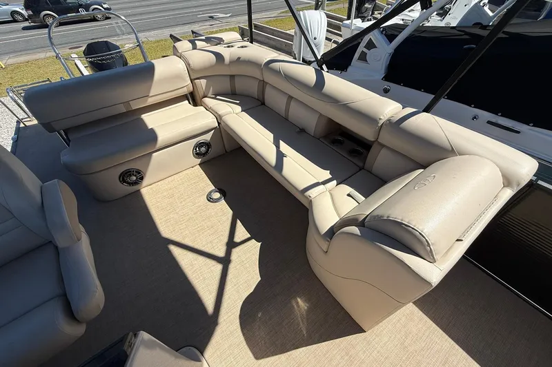 Slide: The Image of Luxurious seating on a 2019 Harris Cruiser 250 pontoon boat, featuring beige upholstery. - 19
