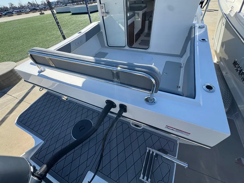 Slide: The Image of 2025 Defiance San Juan 220 boat deck with seating and storage area. - 19