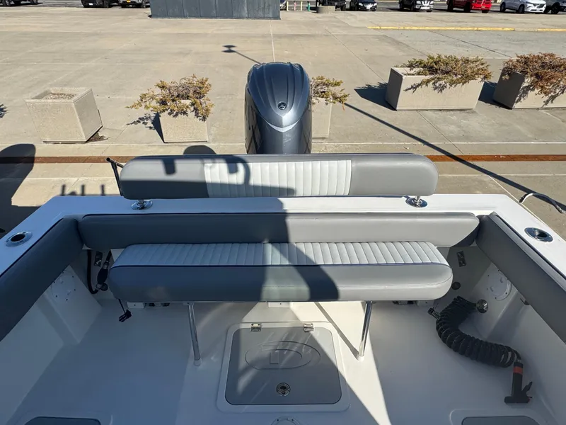 Slide: The Image of 2025 Defiance San Juan 220 boat interior with seating and outboard motor. - 20