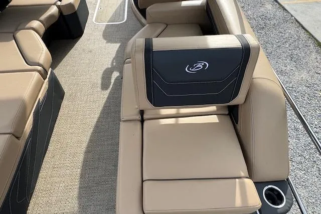 Slide: The Image of 2026 Barletta Cabrio 24M boat interior with tan leather seating and cup holder. - 14