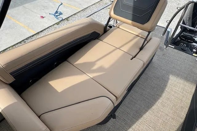 Slide: The Image of 2026 Barletta Cabrio 24M boat interior with beige seating and adjustable backrest. - 15