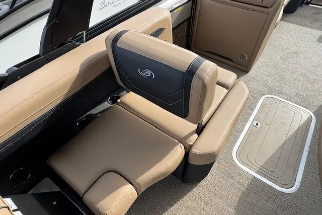 Slide: The Image of Luxurious seating in the 2026 Barletta Cabrio 24M pontoon boat, featuring tan upholstery. - 17