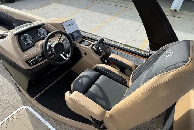 Slide: The Image of 2026 Barletta Cabrio 24M boat interior with modern dashboard and comfortable seating. - 19