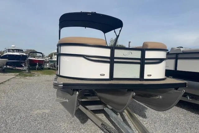 Slide: The Image of 2026 Barletta Cabrio 24M pontoon boat on trailer, outdoor display. - 5