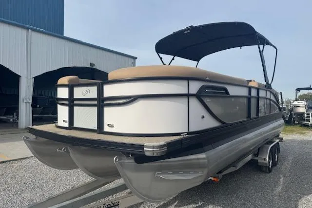 Slide: The Image of 2026 Barletta Cabrio 24M pontoon boat on trailer, featuring sleek design and canopy. - 6