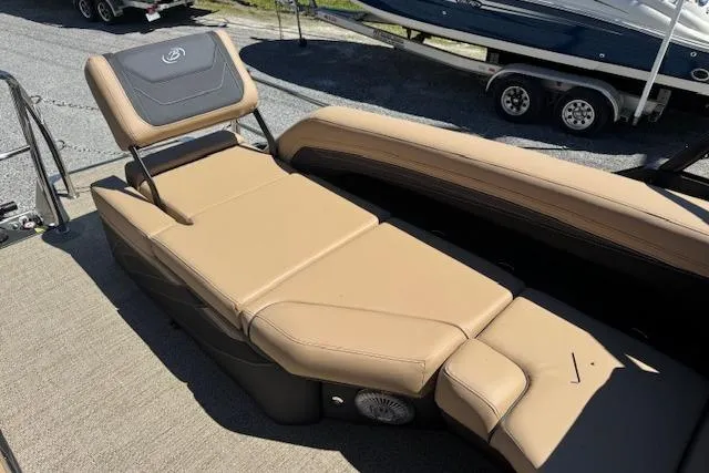 Slide: The Image of 2026 Barletta Cabrio 24M boat with tan leather seating and adjustable backrest. - 8
