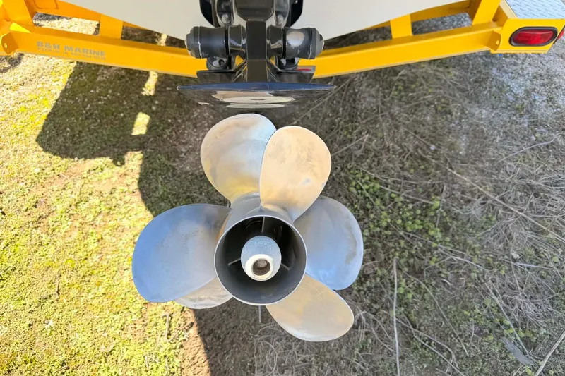 Slide: The Image of Propeller of a 2005 Crownline 270 BR boat on a yellow trailer. - 12