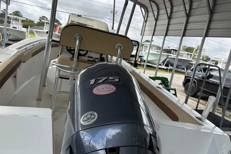 Slide: The Image of 1999 Contender 21 Open boat with 175 horsepower engine in covered storage. - 10
